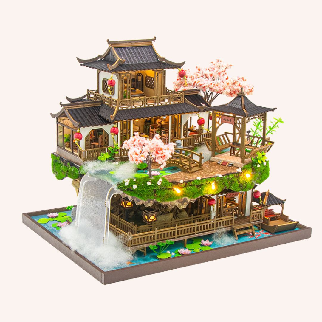 The Lotus Pavilion DIY miniature house kit with three-tier Asian pagoda, waterfall, cherry blossoms and LED lights