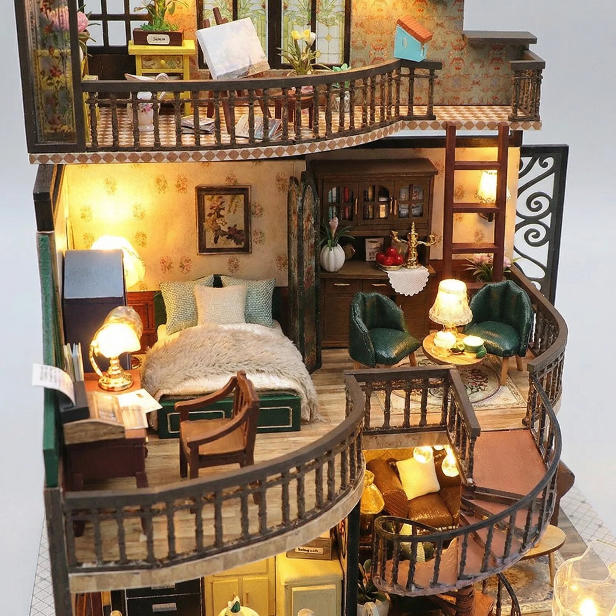 The Grand Townhouse DIY miniature kit showing illuminated three-story dollhouse with bedroom, living room and rooftop garden