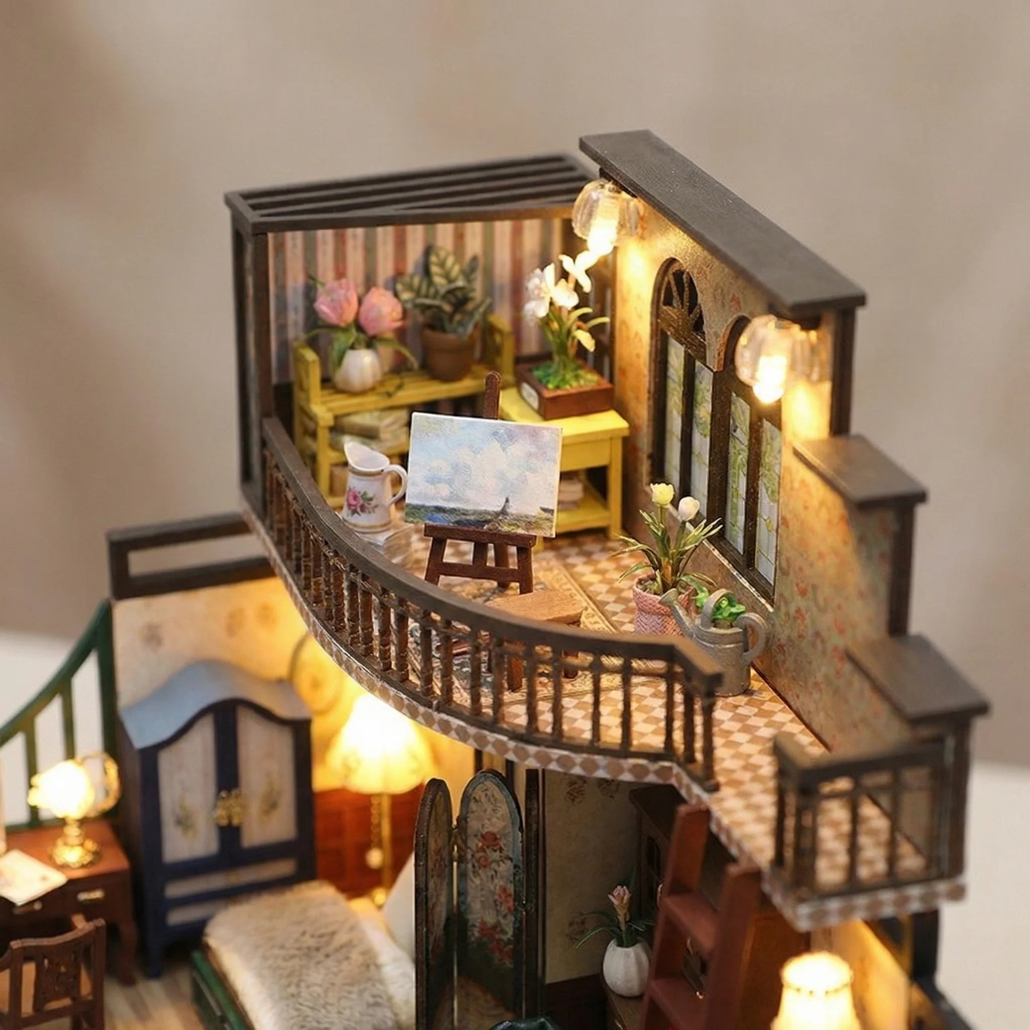 Grand Townhouse miniature dollhouse kit with illuminated curved balcony studio featuring art easel and plants