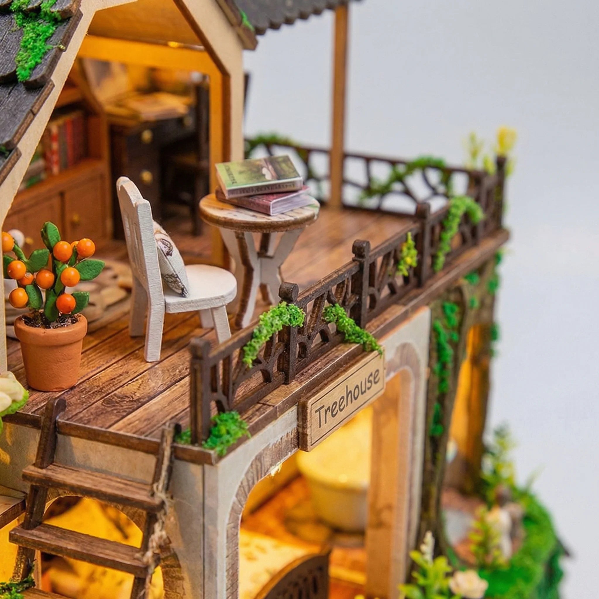 The Garden Hideaway miniature kit wooden balcony with tiny chair books orange berry plant and decorative railing