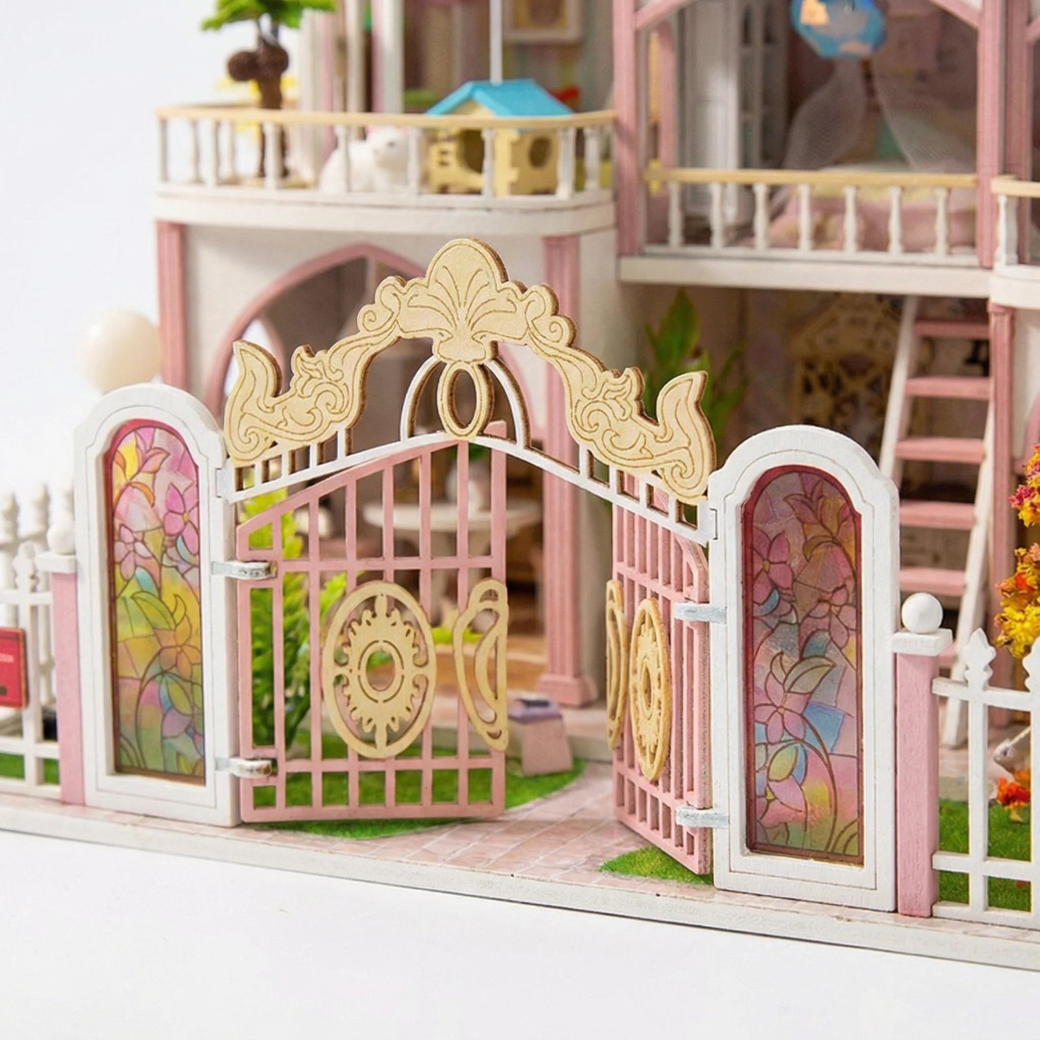 The Rose Palace DIY miniature dollhouse kit ornate white and pink gate with stained glass floral panels and gold details