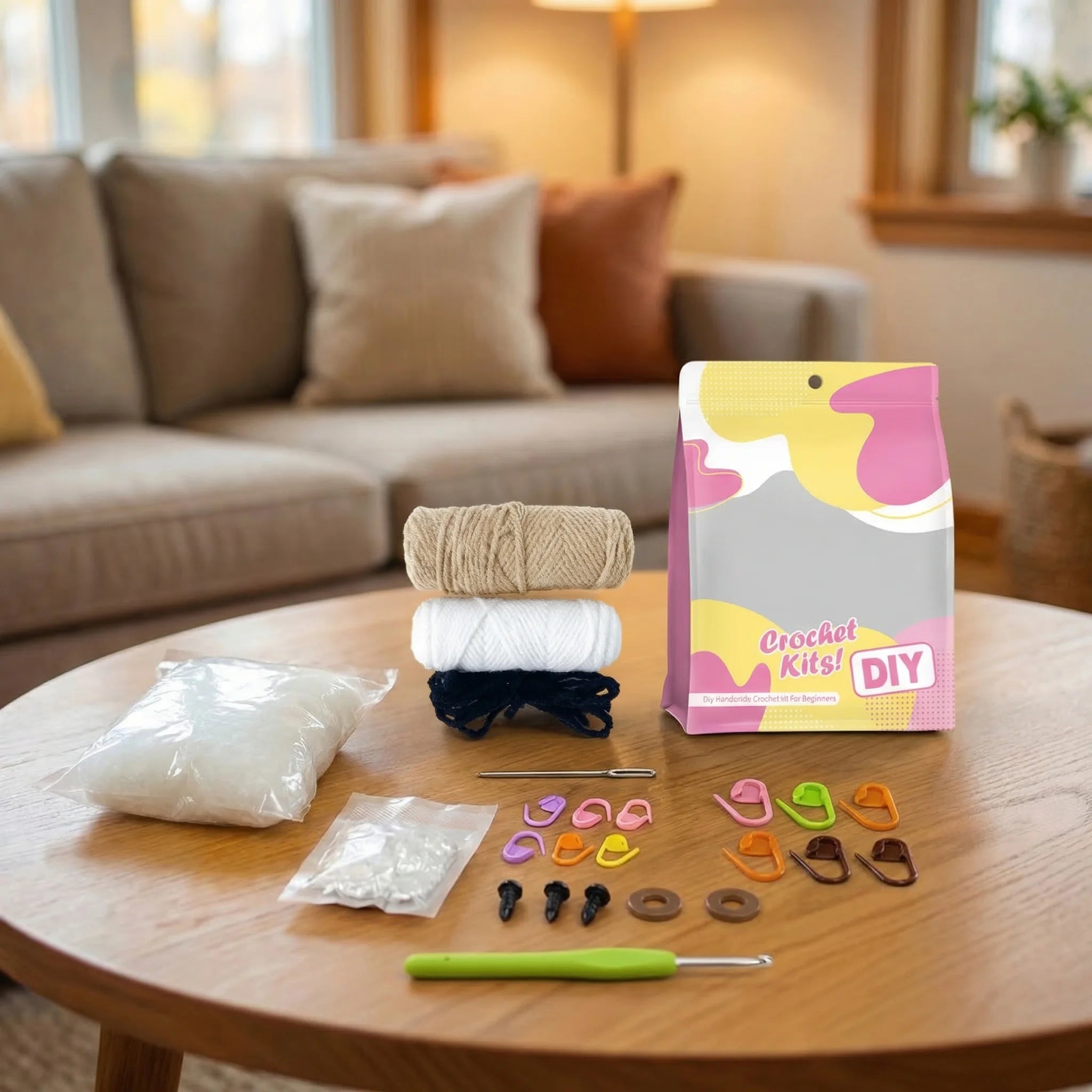 Hamish the Highland Cow DIY crochet kit contents including yarn, stuffing, hooks, stitch markers and pattern on table