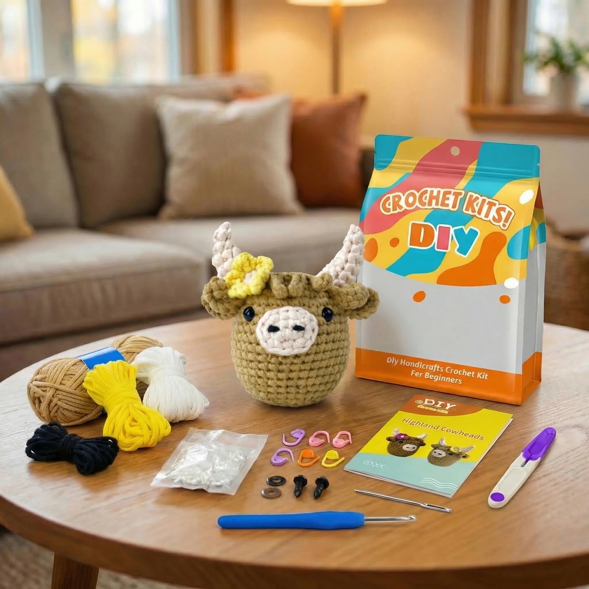 Daisy the Highland Cow DIY crochet kit contents including yarn, hooks, stuffing, stitch markers and instruction booklet