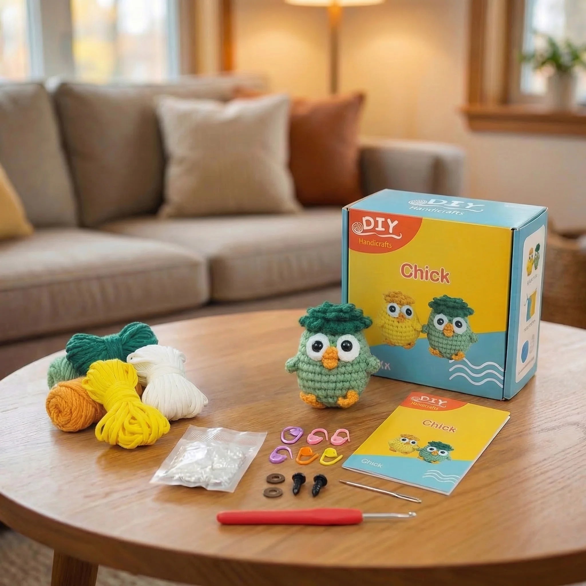 The Wise Oak DIY crochet kit contents displayed with completed green owl amigurumi, yarn, hook, and instructions