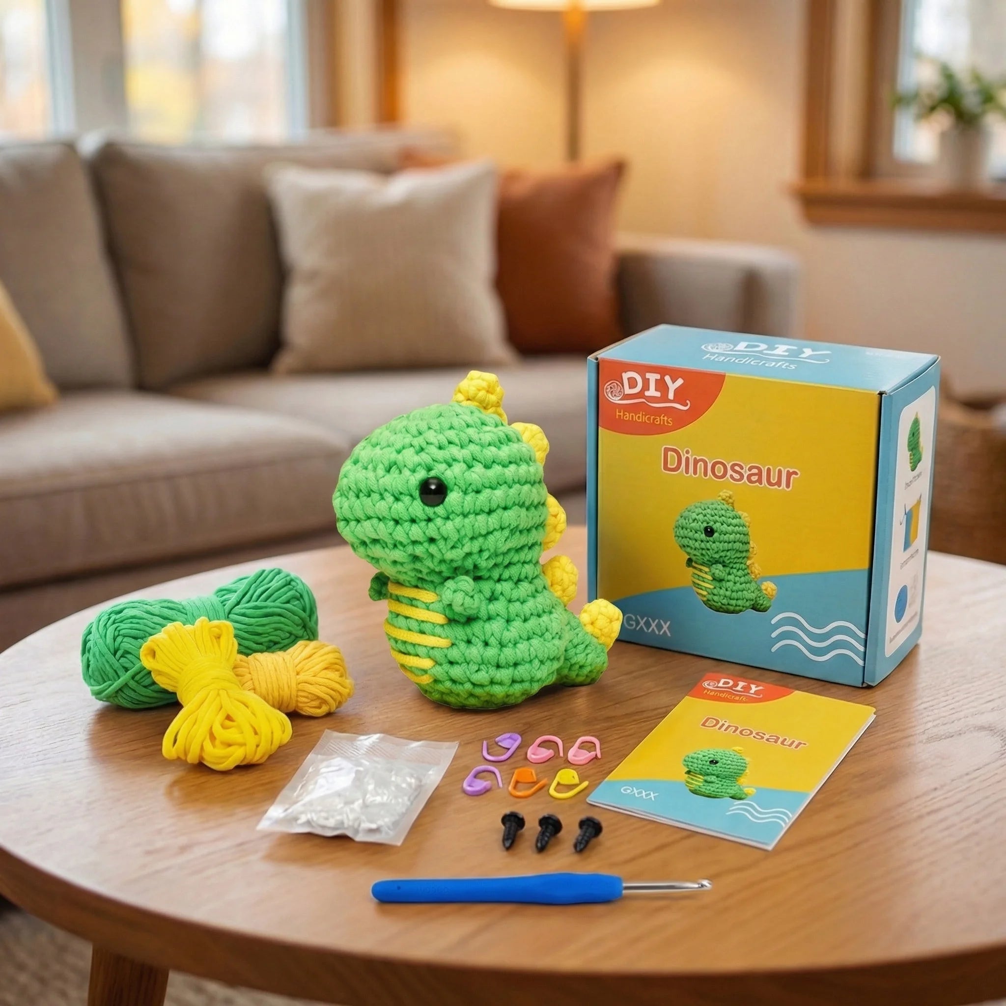 The Little Dragon DIY crochet kit contents with green yarn, hook, pattern, safety eyes, and finished mini dinosaur