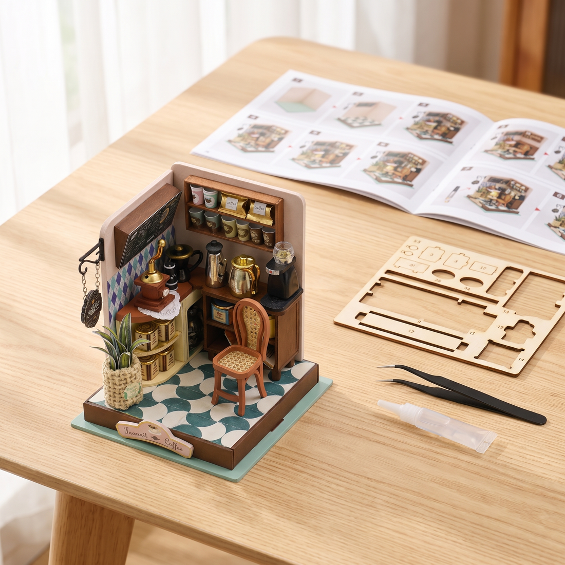 The Daily Grind kit mid-build with tweezers and instructions