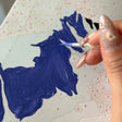 Painting a numbered section of the custom canvas