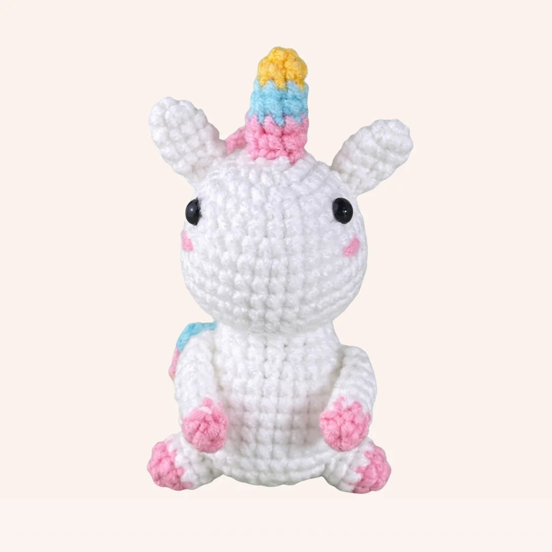 The Rainbow Dreamer DIY crochet kit white unicorn amigurumi with rainbow horn and pink hooves