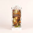 The Tabby Terrace DIY garden book nook kit, assembled with LED lights on