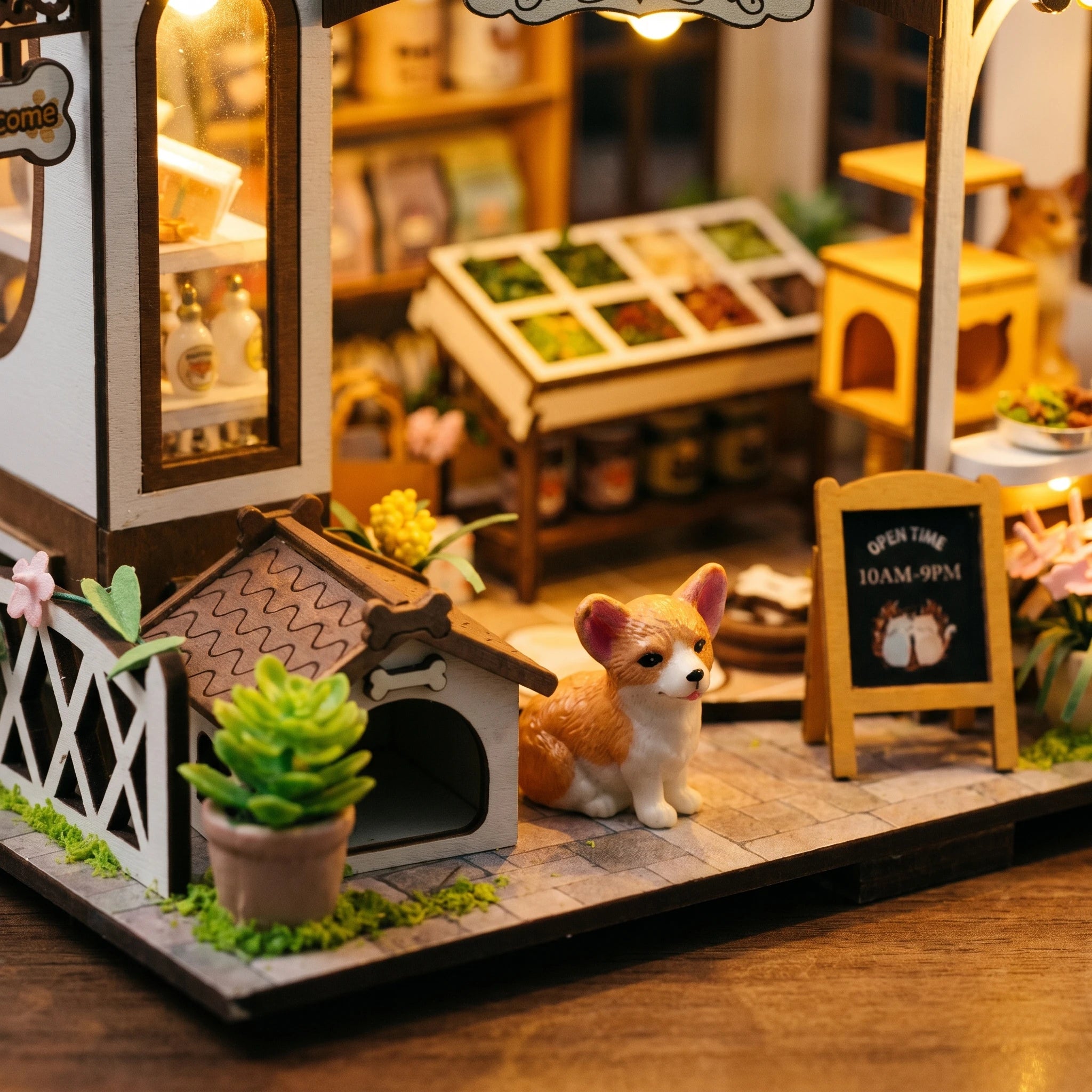 Front garden detail: corgi by the chalkboard sign and doghouse with bone plaque