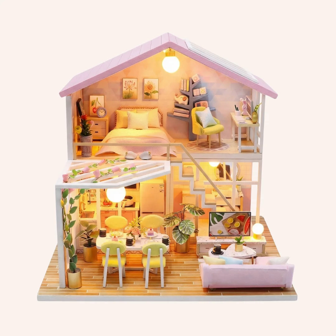 The Sweet Retreat DIY miniature dollhouse kit with illuminated two-story home featuring bedroom, kitchen and outdoor deck