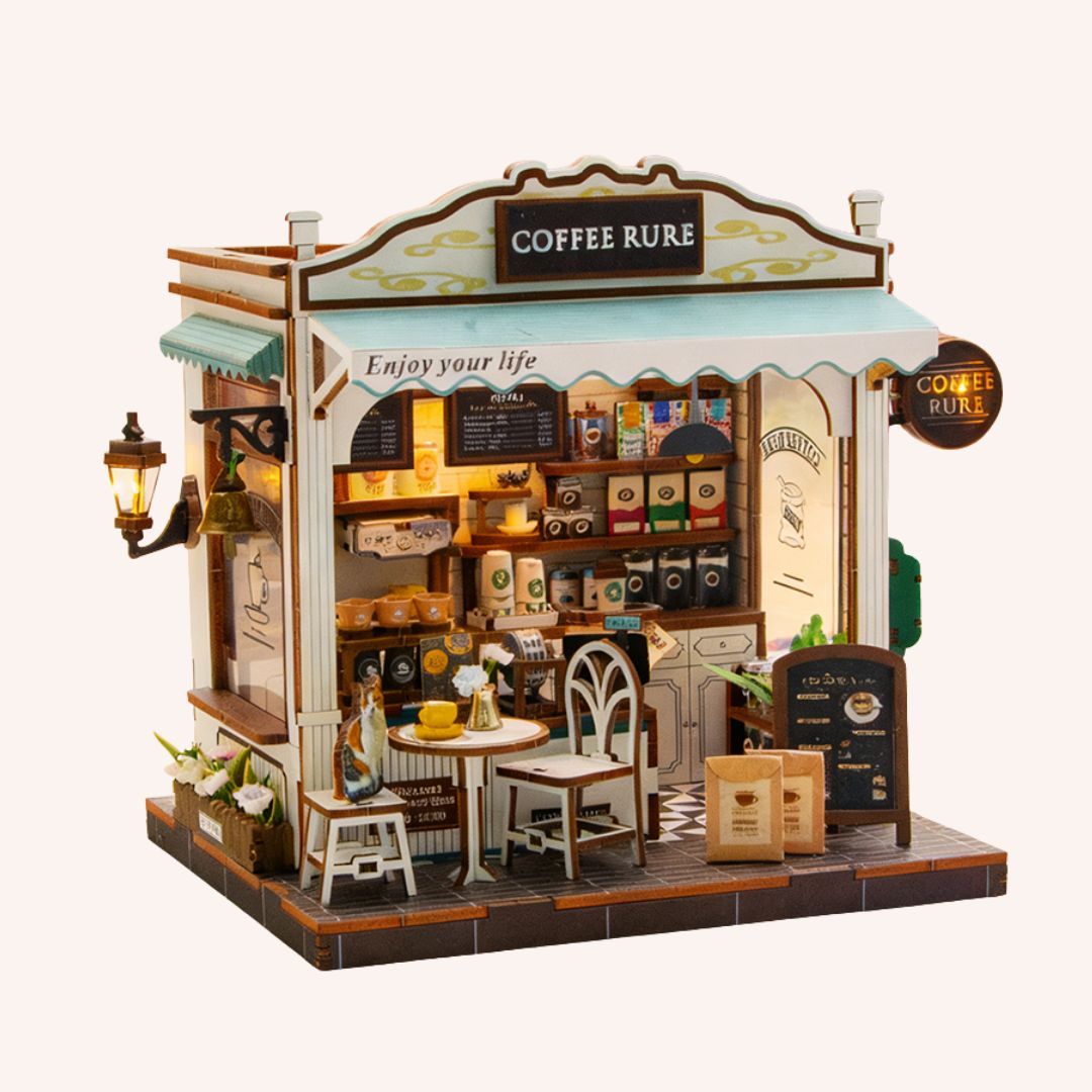 The Coffee Stop miniature DIY dollhouse kit with detailed coffee shop interior, furniture, and LED lighting