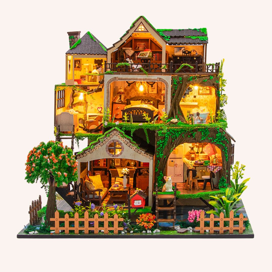 The Garden Hideaway DIY miniature dollhouse kit with illuminated rooms, lush greenery, and multi-level treehouse design