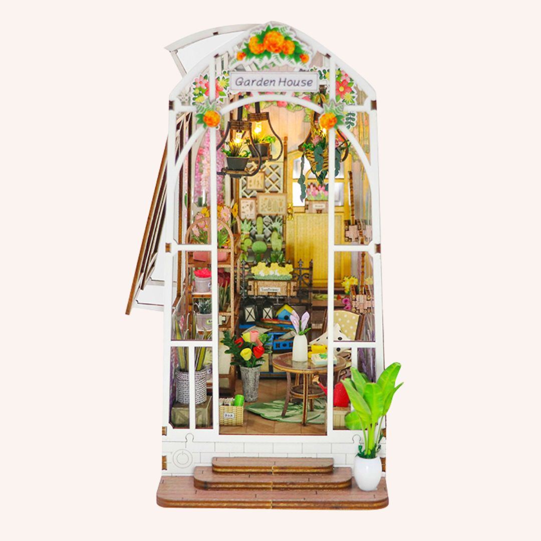 The Garden House DIY miniature kit with illuminated greenhouse interior filled with plants and flowers