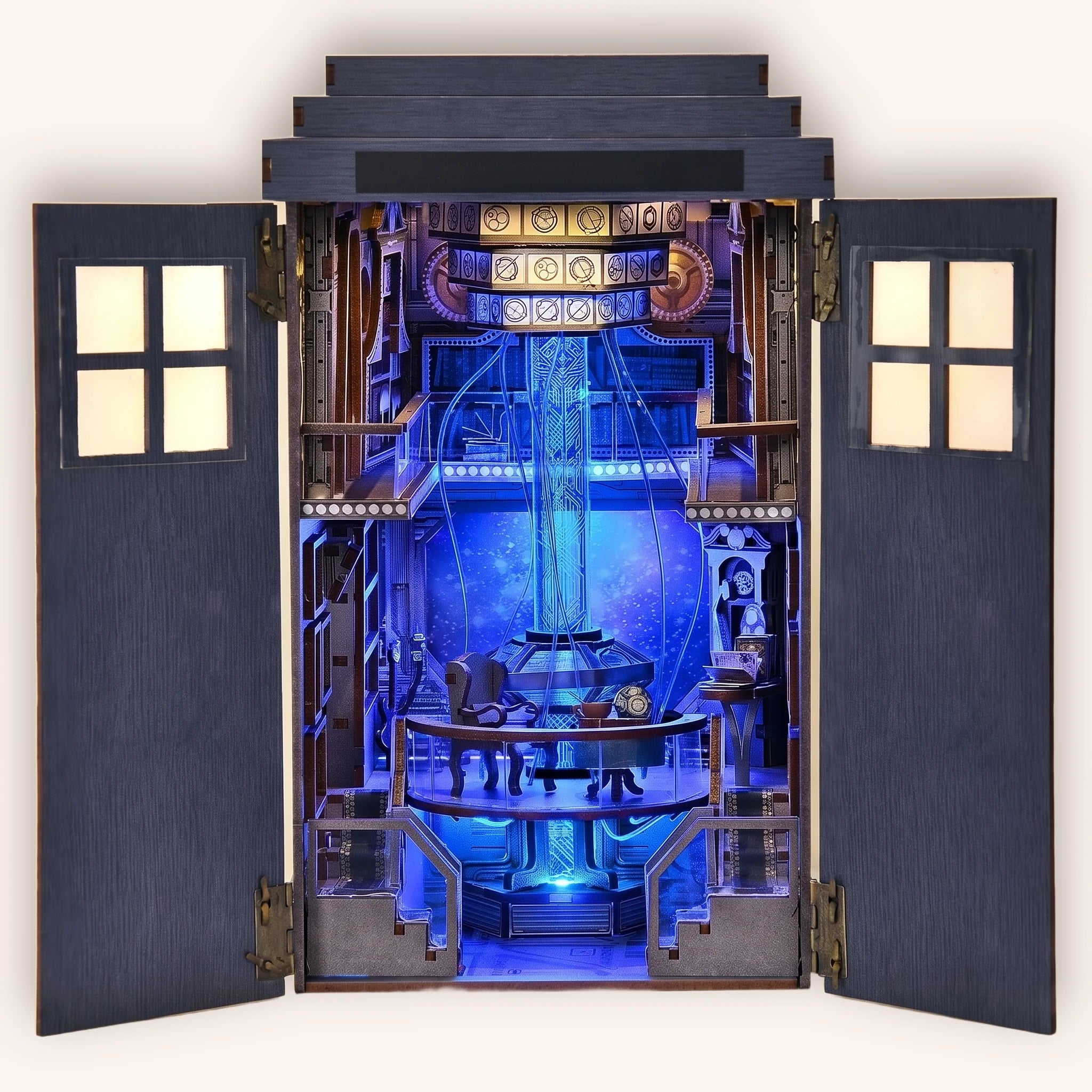 The Time Booth DIY book nook kit, a blue police call box opening to a glowing time-machine console room, on a cream background