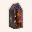 The Arcane Tower DIY book nook on a cream studio background, glowing wizard study tower