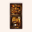 The Book Café DIY book nook kit on the TinyCraft cream background, warm cafe lights glowing