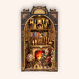 The Cat's Study DIY book nook kit, lit interior on cream background