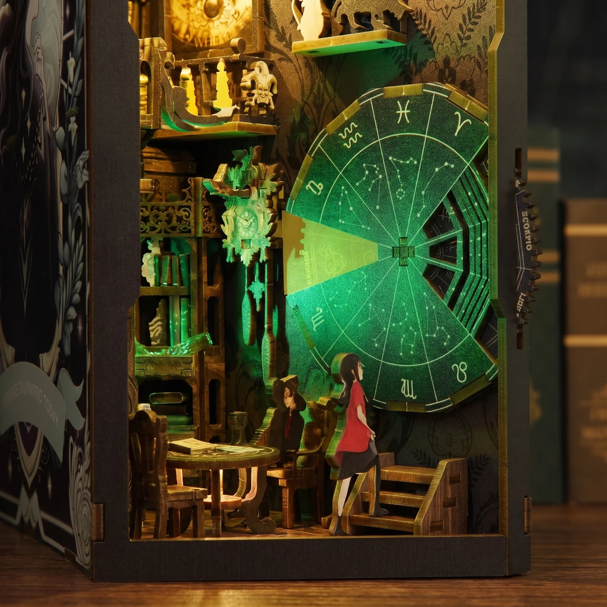 Inside The Clockwork Apothecary book nook, the fortune teller's parlor and glowing zodiac wheel