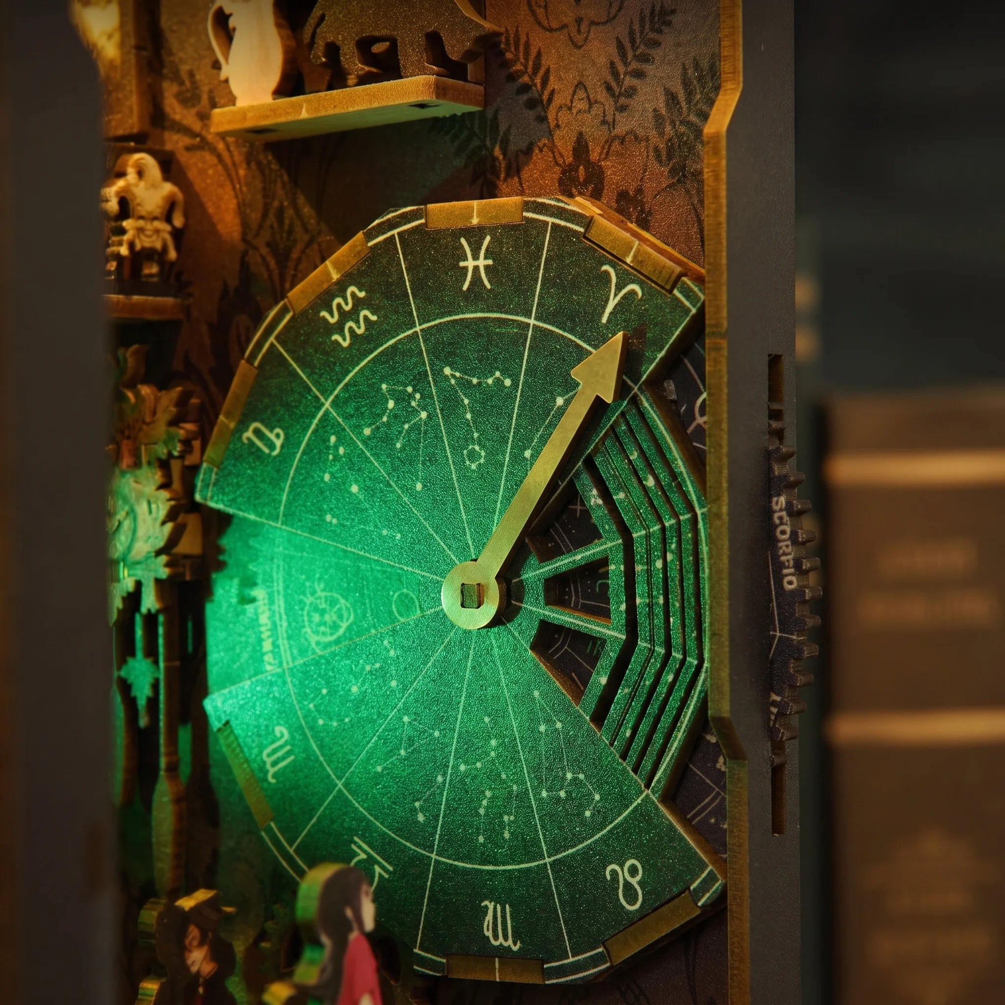 Close up of the glowing green zodiac wheel dial inside The Clockwork Apothecary