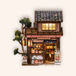 The Corner Store DIY miniature Japanese grocery roombox on a cream studio background