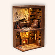 The Detective's Study book nook miniature on a warm cream studio background