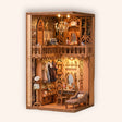 The Dressing Room DIY book nook miniature kit on a cream background, lit warm