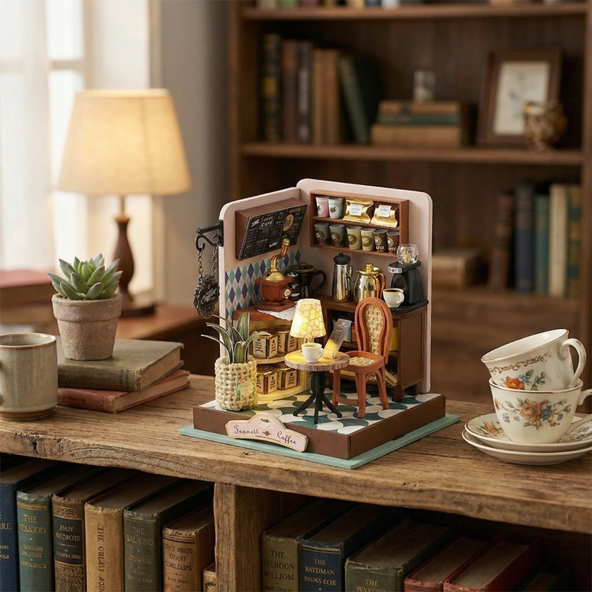 The Daily Grind miniature coffee shop DIY kit displayed on rustic wooden table with books and teacups