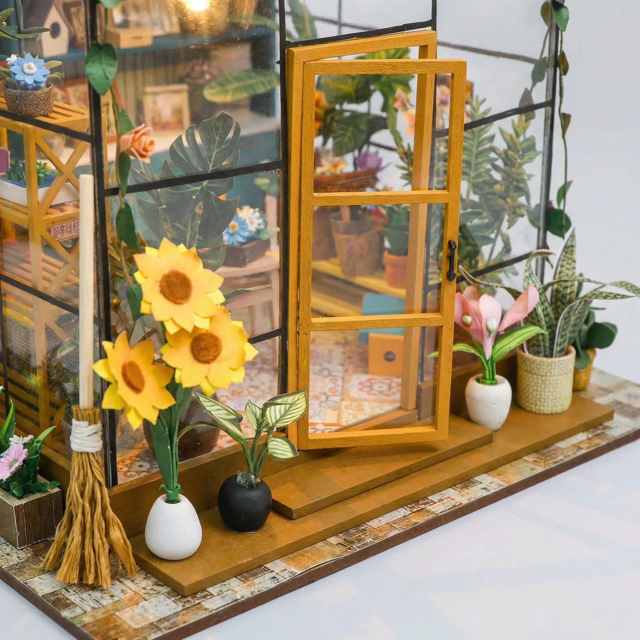 The Sunflower Glasshouse miniature kit contents – wood sheets, accessories and LED lights