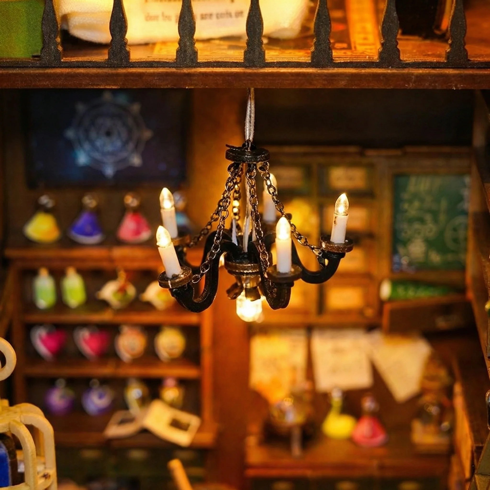The Wizard's Study miniature kit chandelier with LED lights and potion bottles on wooden shelves
