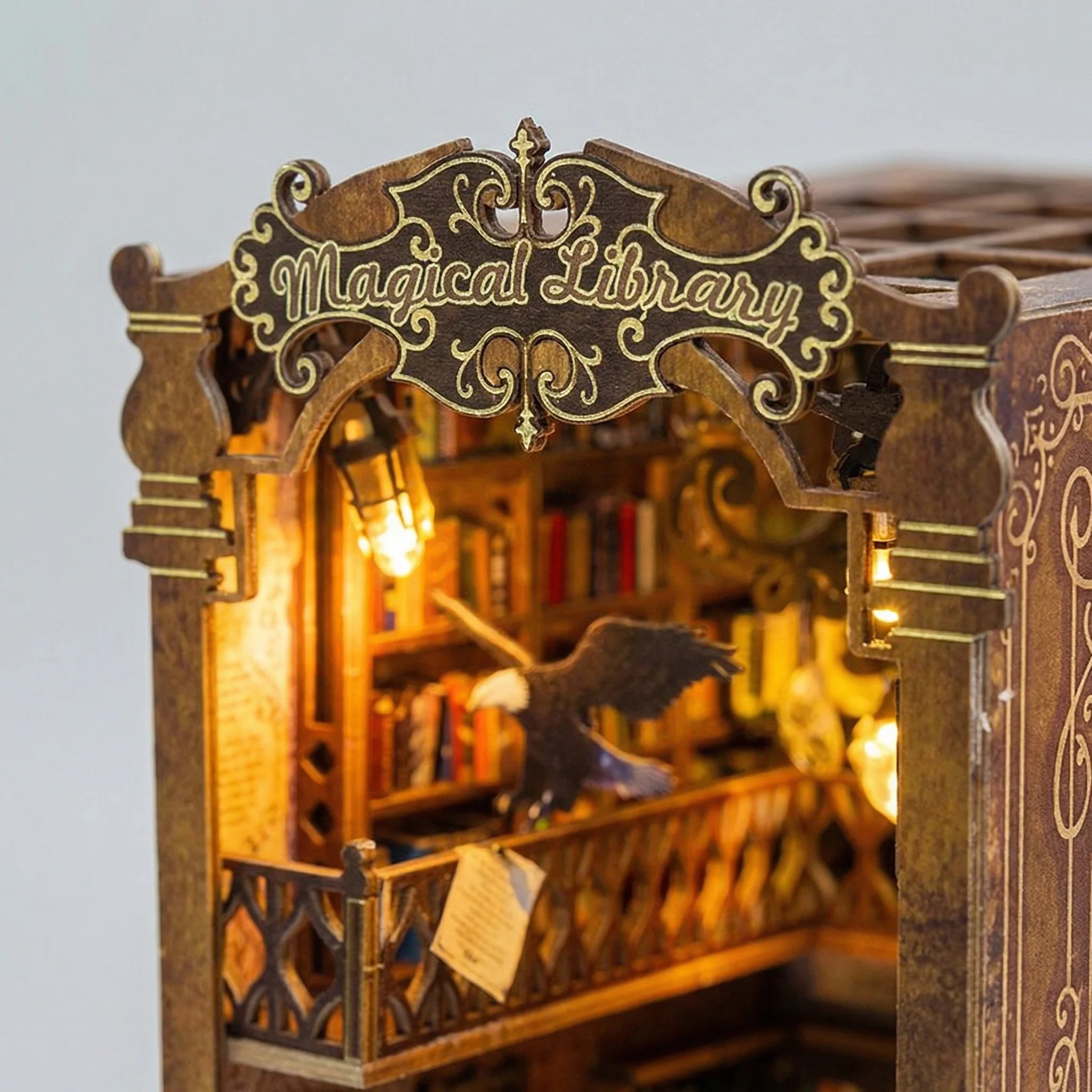 The Eternal Archive miniature library kit entrance archway with ornate Magical Library sign and warm LED lighting