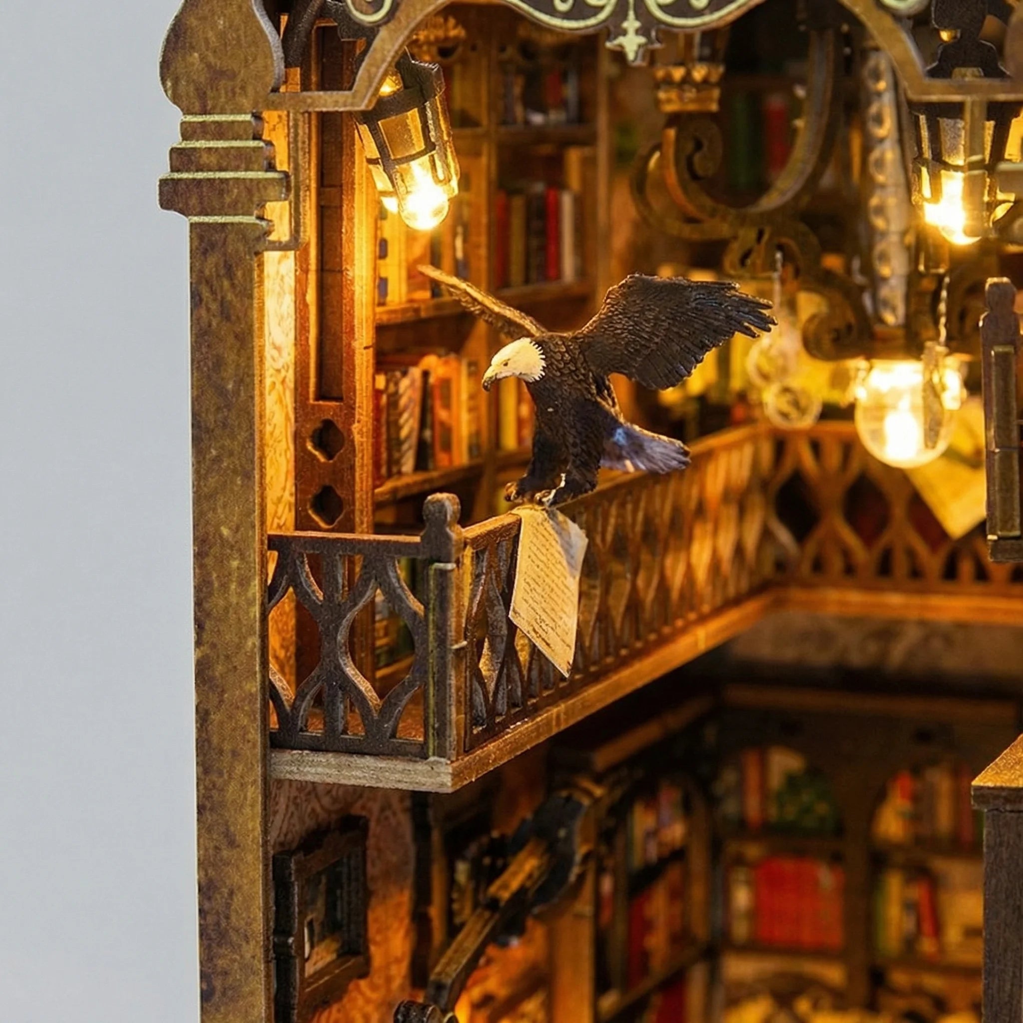 The Eternal Archive miniature kit featuring illuminated balcony with detailed eagle sculpture and ornate wooden railings