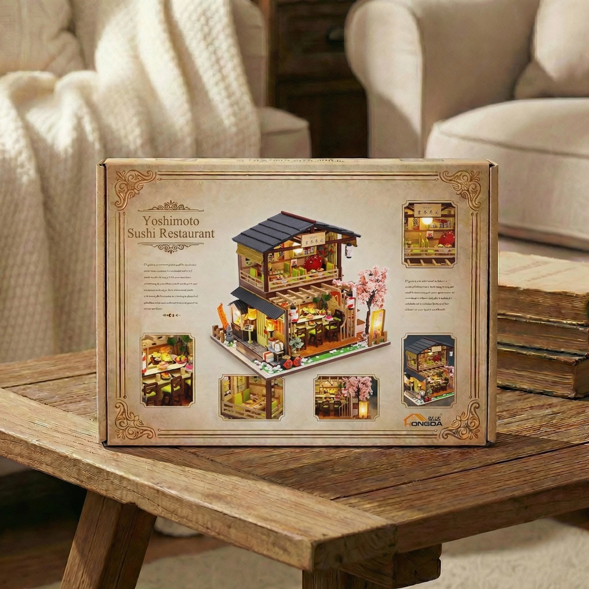 The Sakura Sushi Bar miniature kit box displayed on rustic wooden table in cozy living room setting