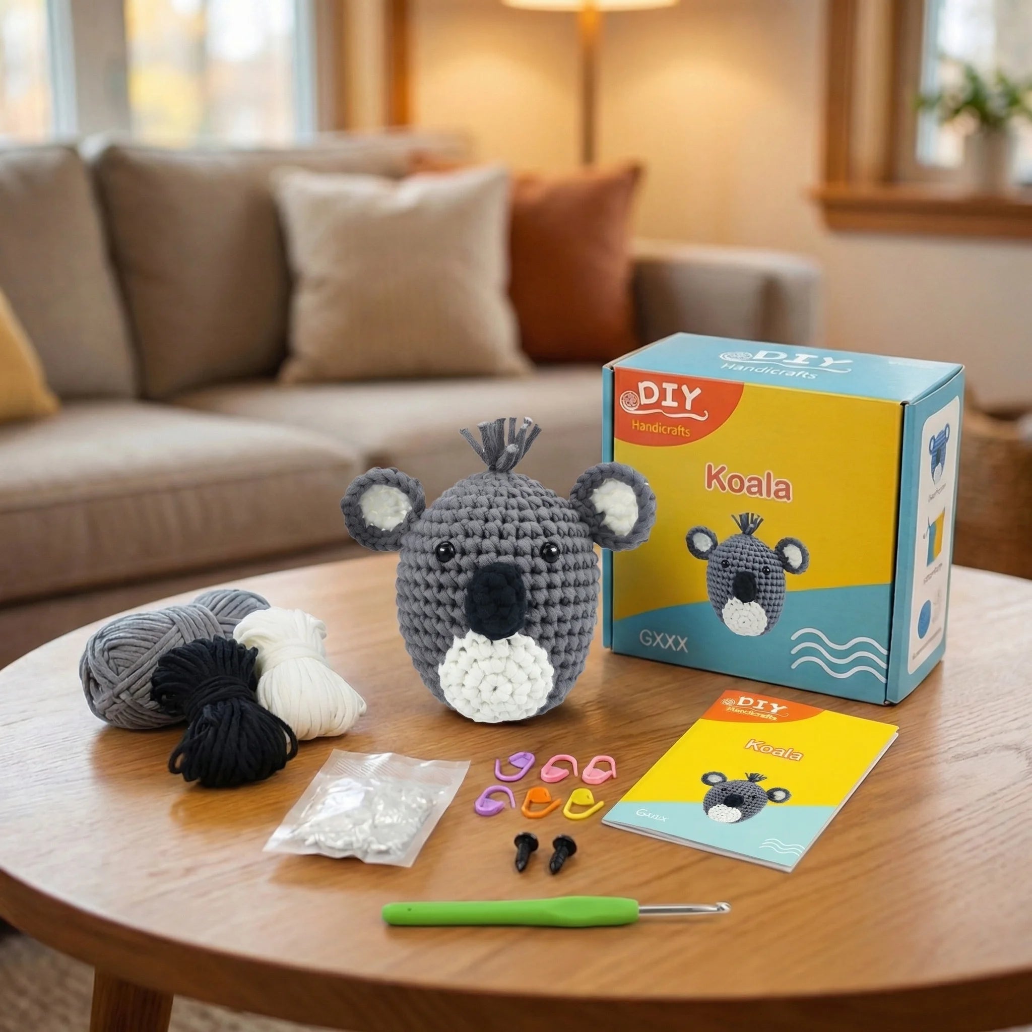 The Outback Cuddle DIY crochet kit contents including gray koala amigurumi, yarn, hook, instruction booklet and accessories