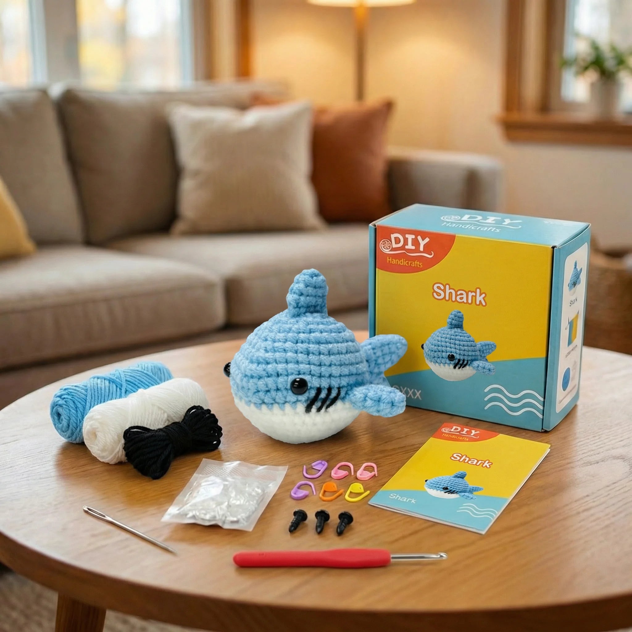 The Ocean Grin crochet kit contents – yarn, hook, safety eyes and guide