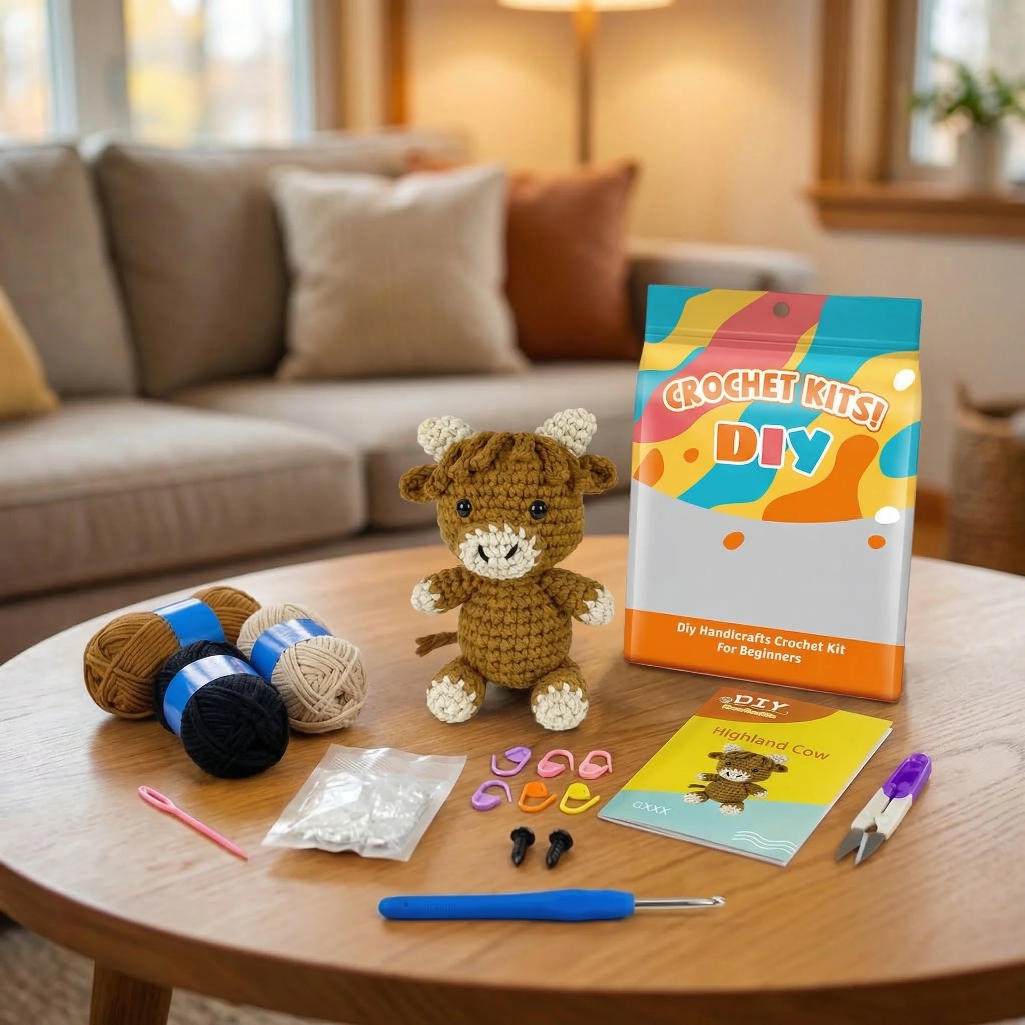 The Prairie Companion DIY crochet kit contents with Highland Cow amigurumi, yarn, hook, and beginner instructions