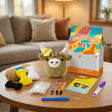 Daisy the Highland Cow crochet kit contents – yarn, hook, safety eyes and guide