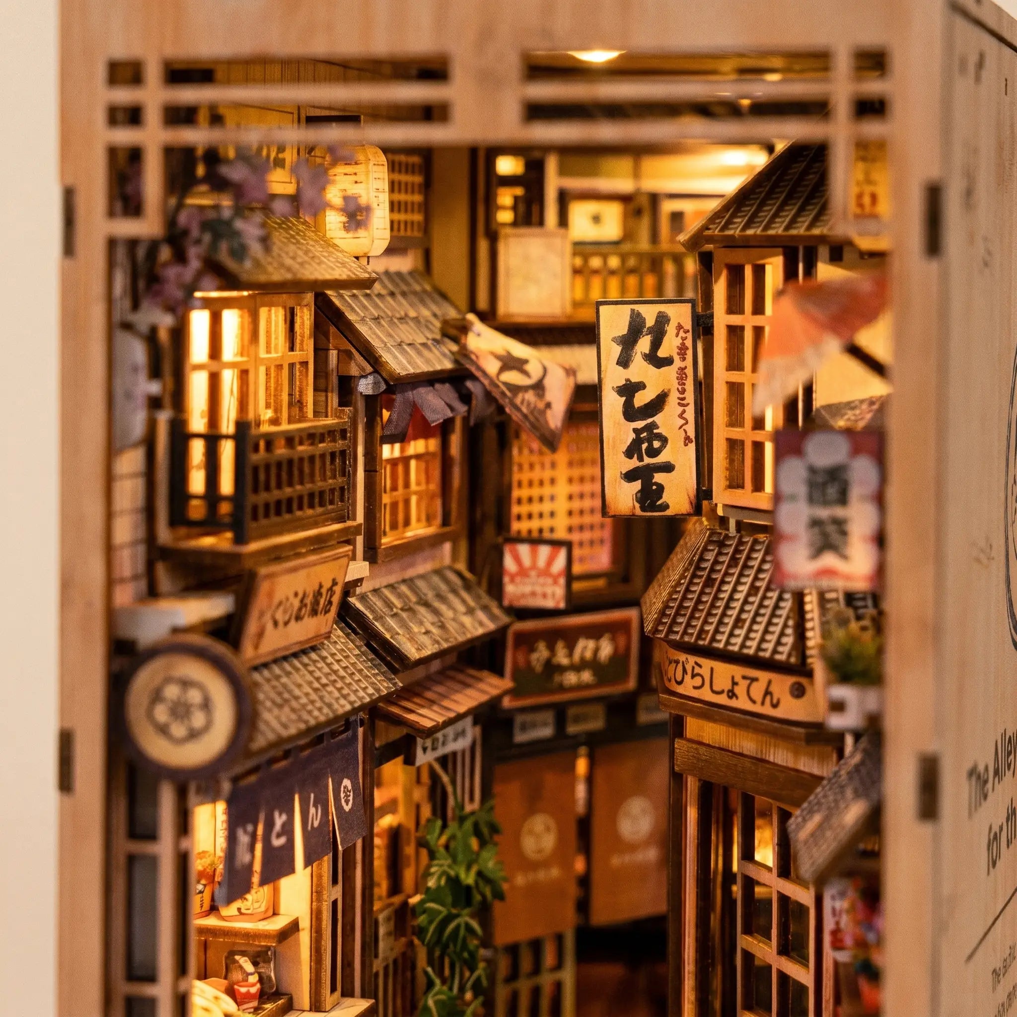 Close-up of the tiled rooftops and hanging noren banners inside The Cat's Alley