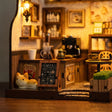 Close-up of the small cat figurine by the chalkboard sign at the entrance inside The 1987 Cafe