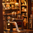 Close-up of the writing desk with scroll, candelabra and vintage clock inside The Twilight Library