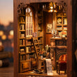 Close-up of the tall arched window and ladder against the towering bookshelves inside The Twilight Library