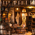 Close-up of the classical statue in its warmly lit alcove inside The Bacchus Bookstore