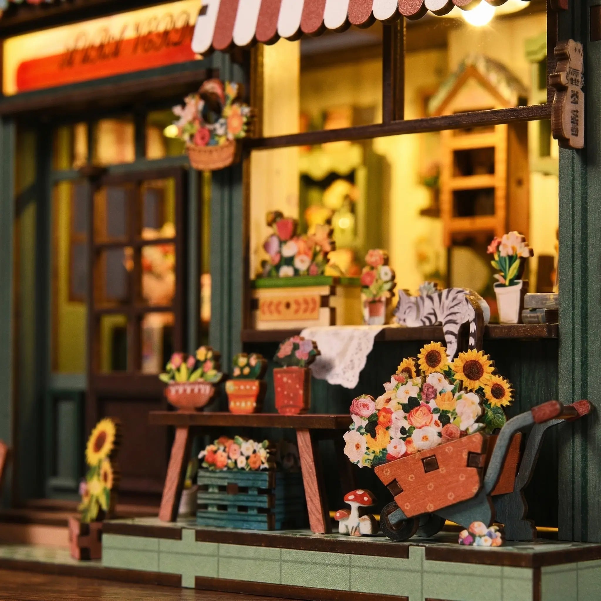 Close-up of the buckets and cart overflowing with sunflowers and roses inside The Aura Verde Flower Room