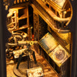 Close-up of the lit interior of The Stargazer, brass telescope and astronomer's desk in warm lamplight