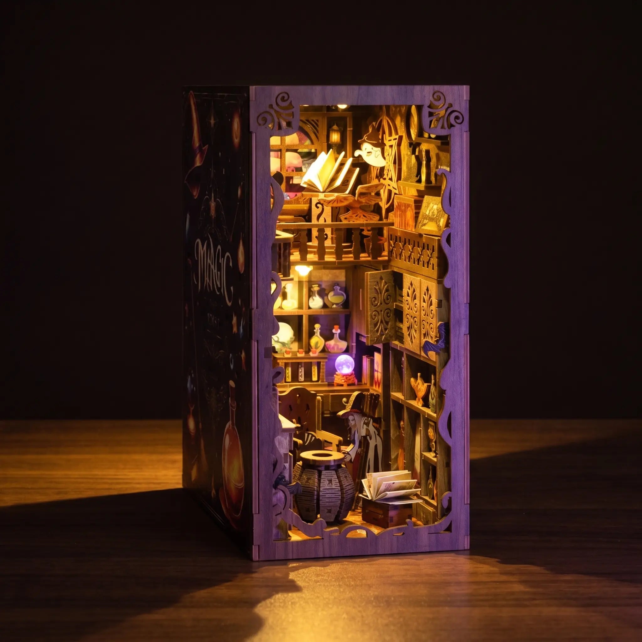 The Apothecary book nook glowing on a dark walnut backdrop