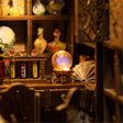 Macro detail of the glowing crystal orb inside The Apothecary