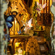 Detail of the winged fairy and blue butterfly inside The Fairy Glen book nook