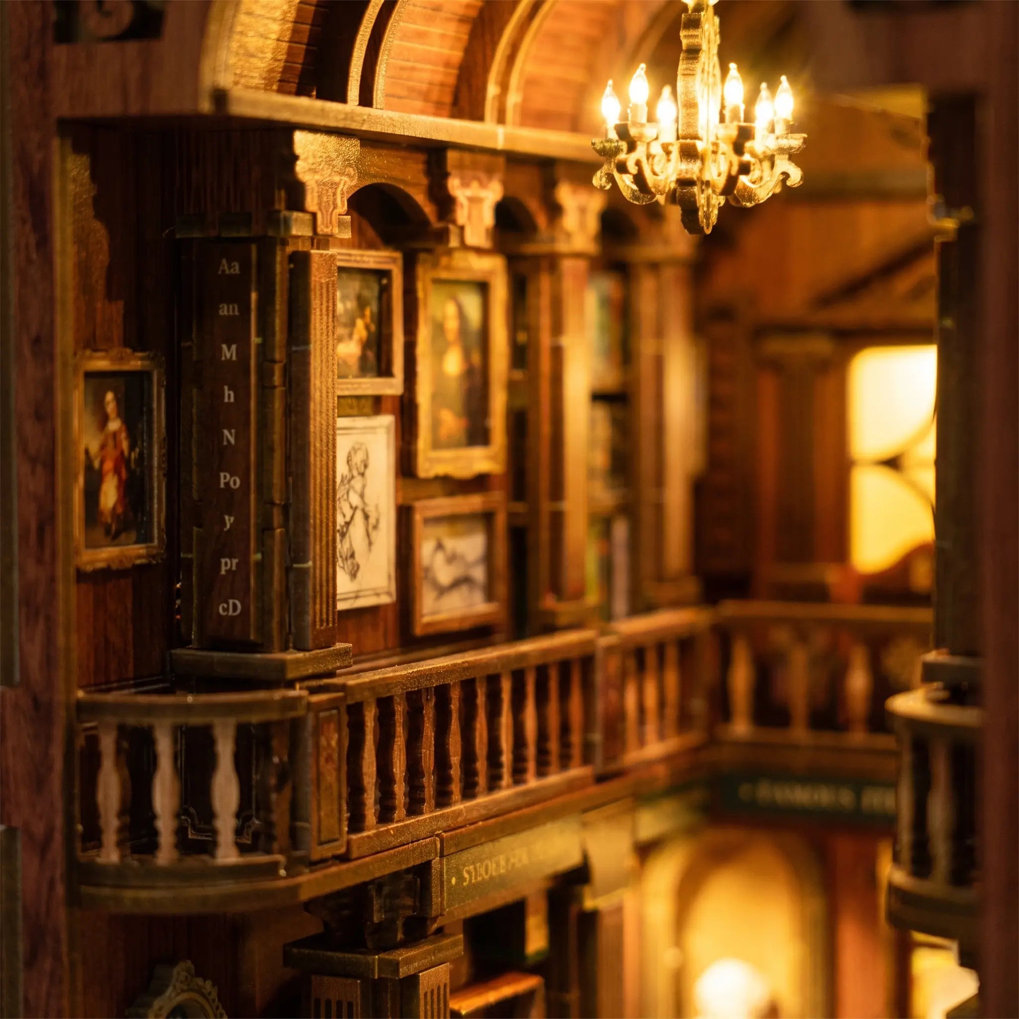 Upper balcony railings and framed art inside The Grand Exhibition book nook