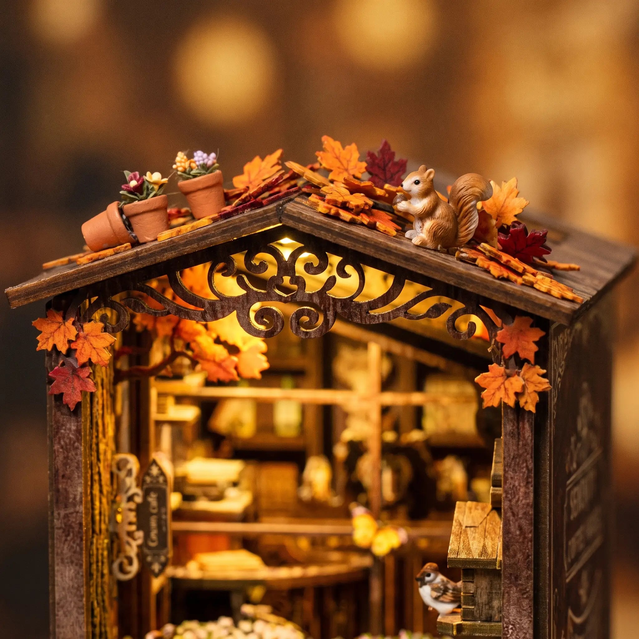 Close-up of autumn foliage and a tiny squirrel on the rooftop of The Book Café