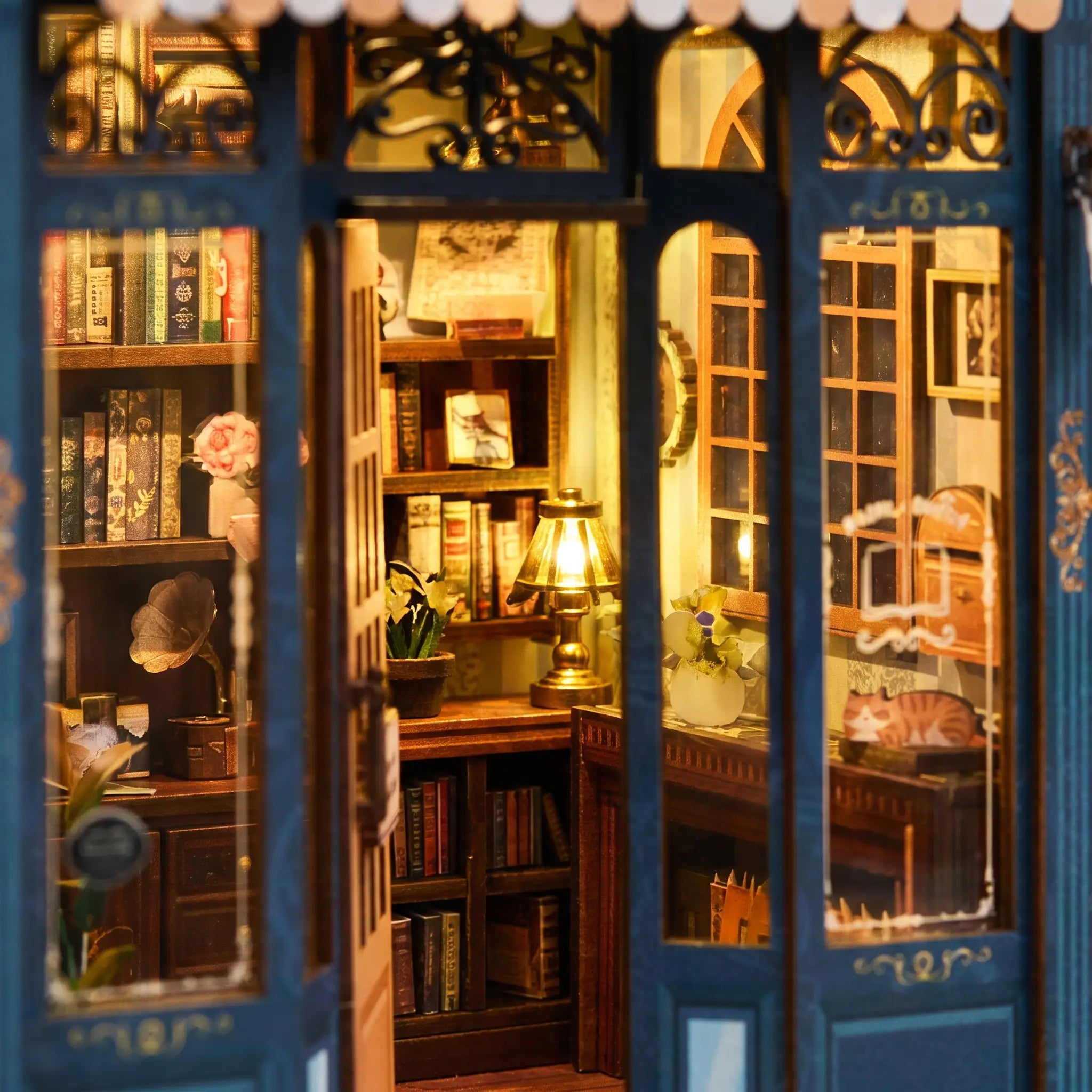 Macro view of the warm lit interior of The Corner Bookshop with tiny bookshelves